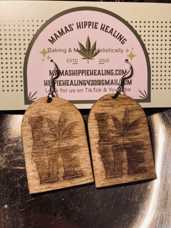 Handcrafted earrings made of wood with "Love" engraved. Wire loop.