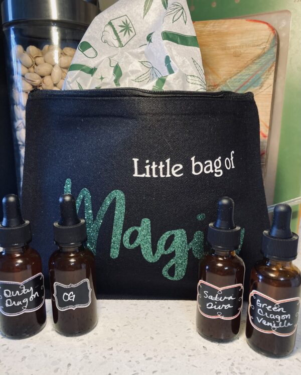 shows little bag with "little bag of magic" design and 4 bottles of tincture