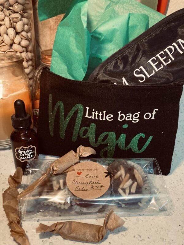 1 Ounce Green Dragon Vanilla Tincture, One Soothing Sleeping Mask, A custom Doobie Pouch, Three Dark Chocolate Cherry Fudge Bark (with RSO) *in the event that we are sold out of the Cherry Fudge Bark, Three Elevated Old-Fashioned Caramels